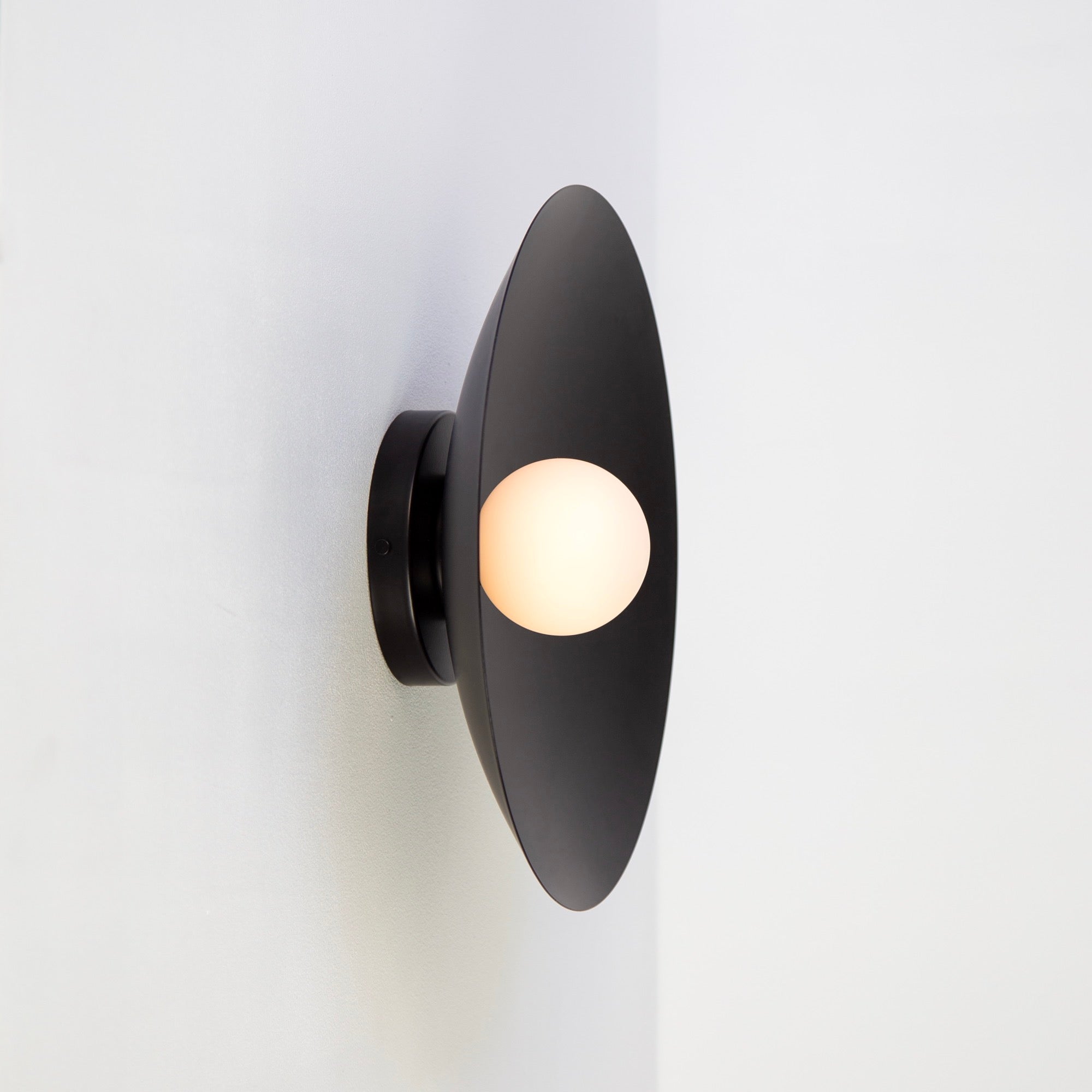 Black Wall Sconce from 101 Copenhagen vs Oluce